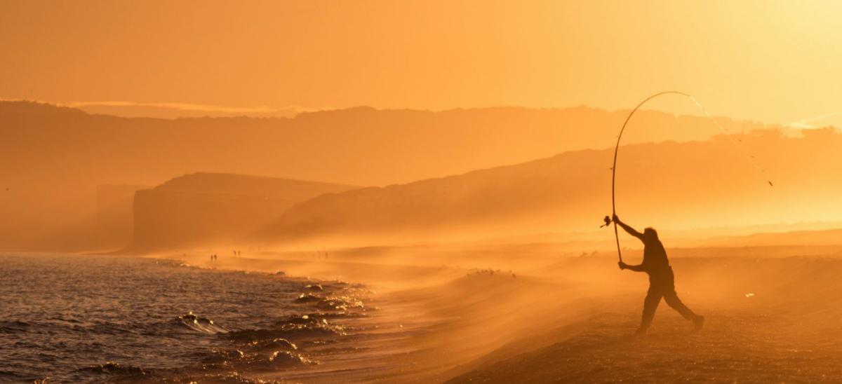 Man fishing at Chesil Beach at West Bexington copyright James Loveridge