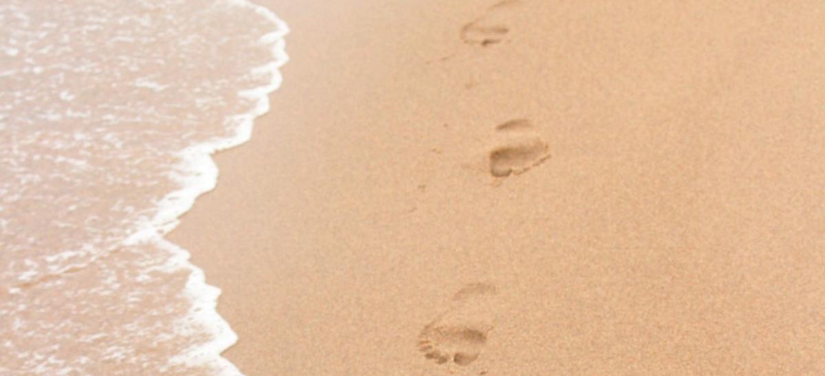 Footprints in the sand at the beach