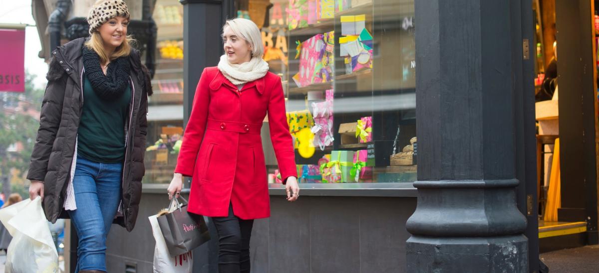 Two women shopping during winter in Bournemouth