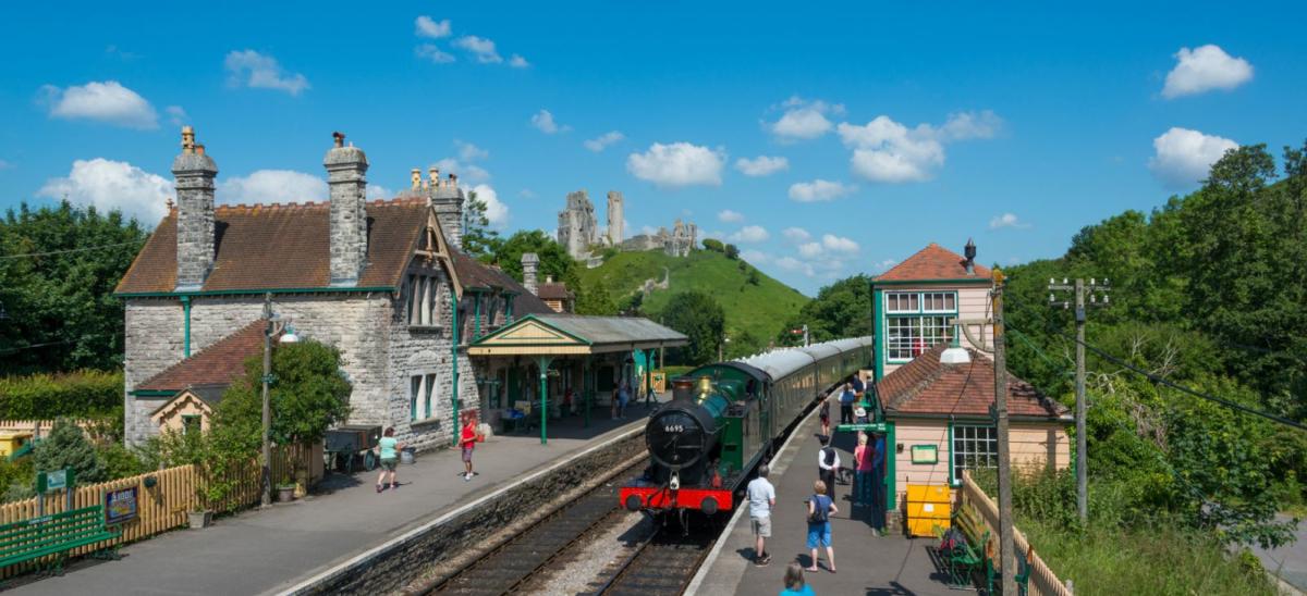 Swanage Railway steam train at Corfe Castle station in Dorset