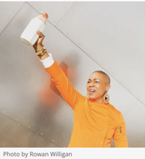 Picture of a women in a orange shirt