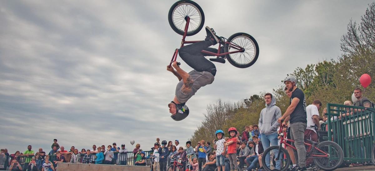 Man performing bike skills at Lyme Regis skate park in Dorset