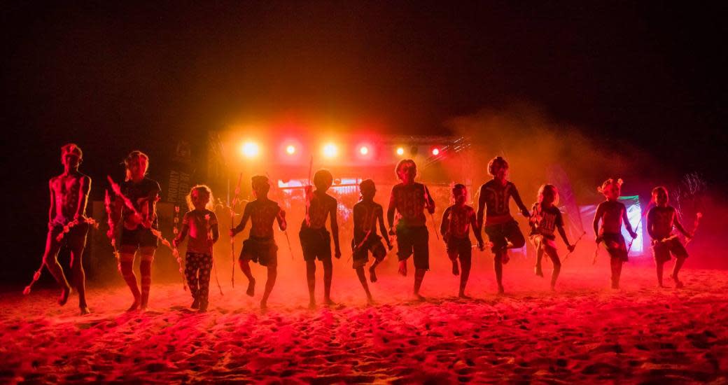 Karijini Experience traditional Dance at night under lights