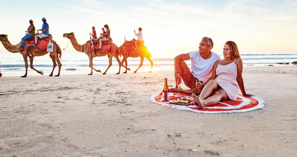 Picnic on Cable Beach with Camel Train in Background