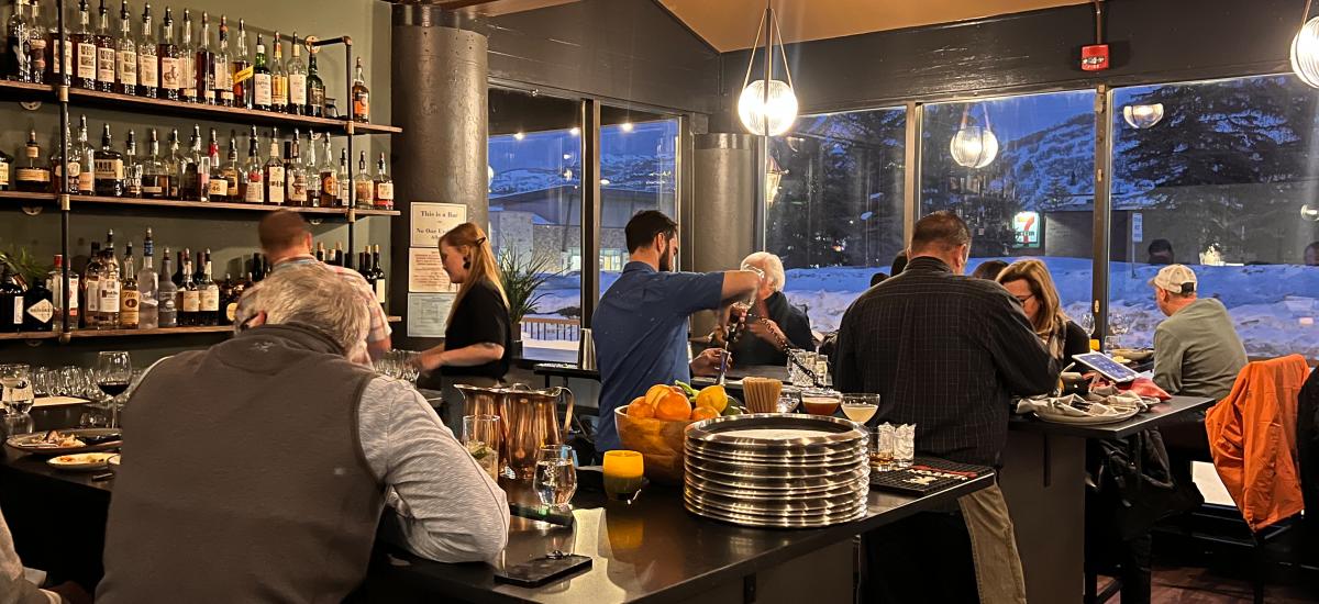 People eating and drinking inside the Tupelo restaurant in Park City, Utah