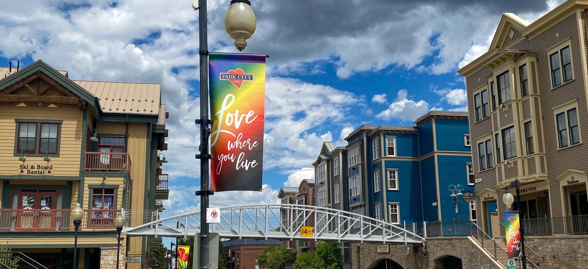 Rainbow sign that reads Love where you live