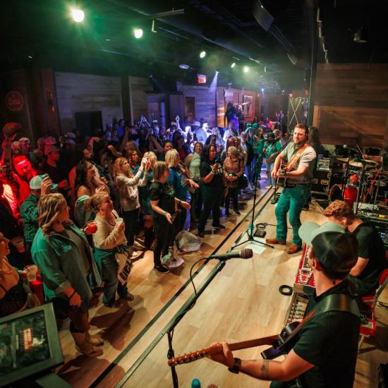 A live performance at PBR Cowboy Bar & Smokehouse