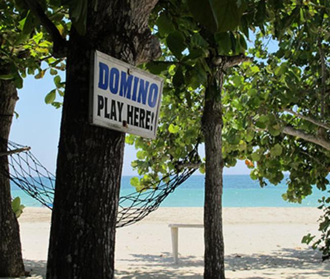 Domino Sign on Beach