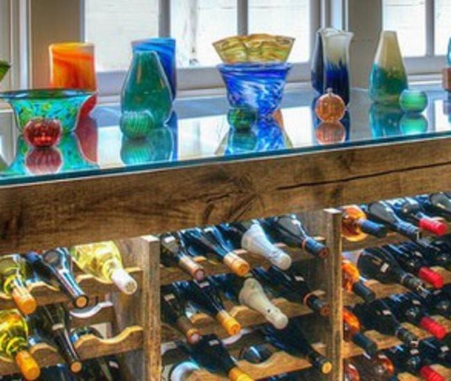 artisan glassware and wine bottles display from Crafted in Haymarket
