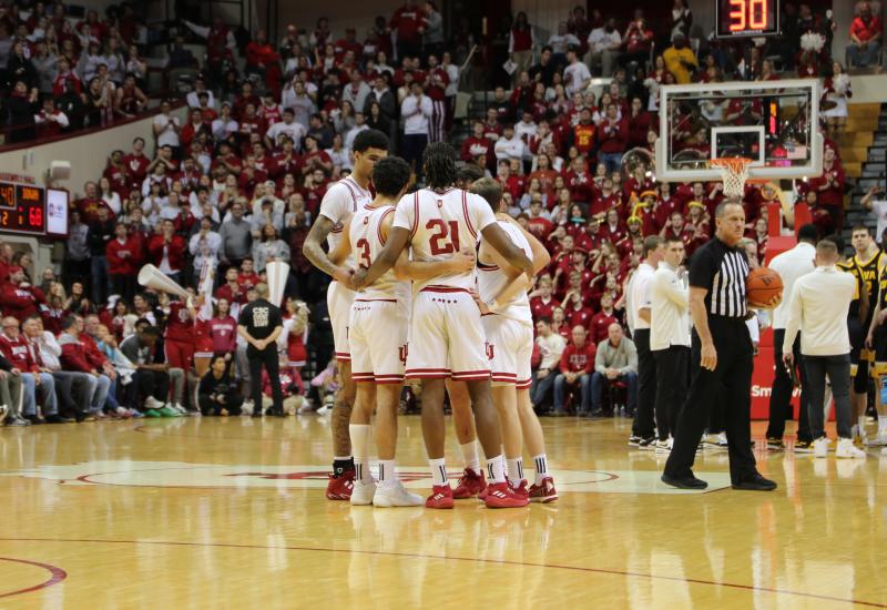 IU Basketball Team huddling on the court