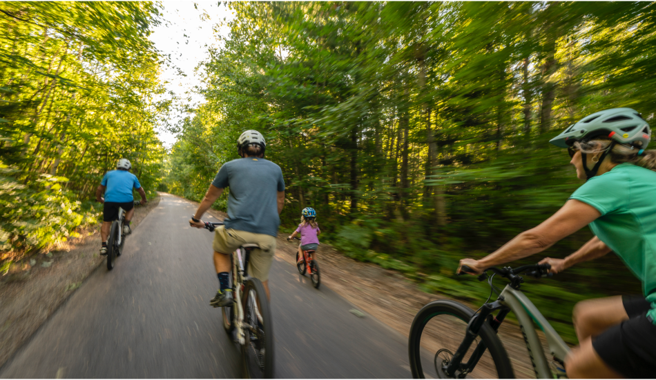 Family biking on Iron Ore Heritage Trail in Marquette County, MI
