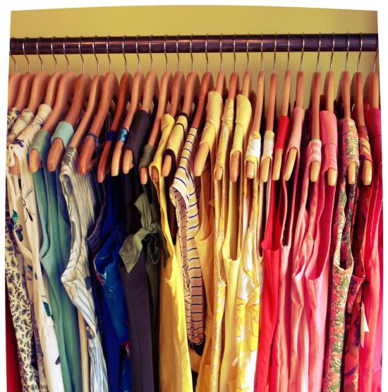 Colorful vintage dresses hanging up at Smartypants Vintage
