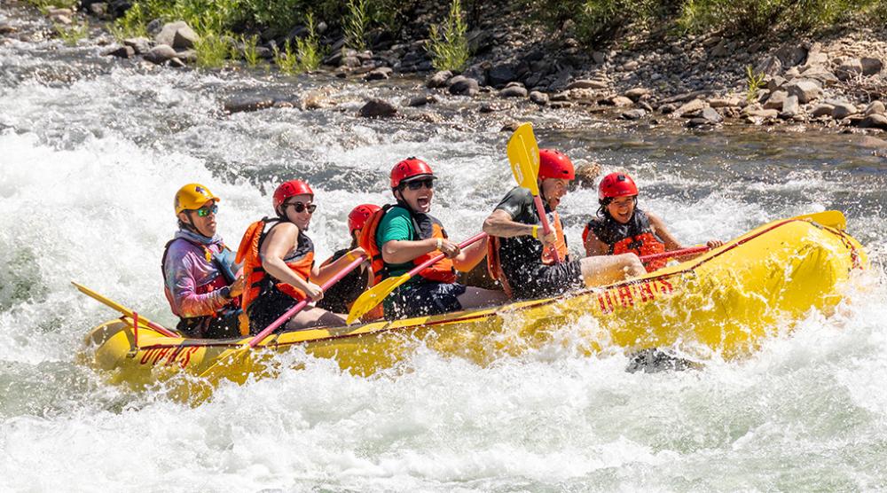 Group of people rafting at a river