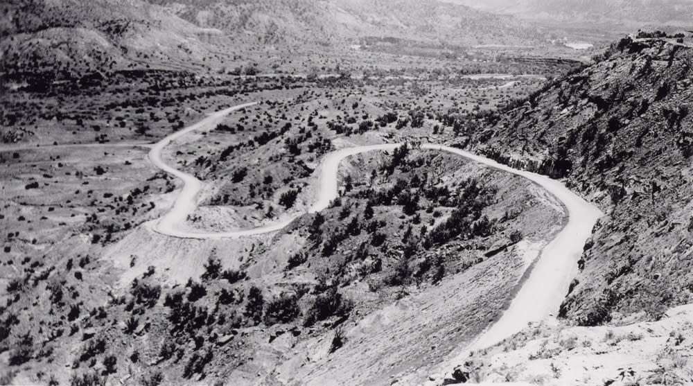 Black and white photo of palo duro canyon road being paved