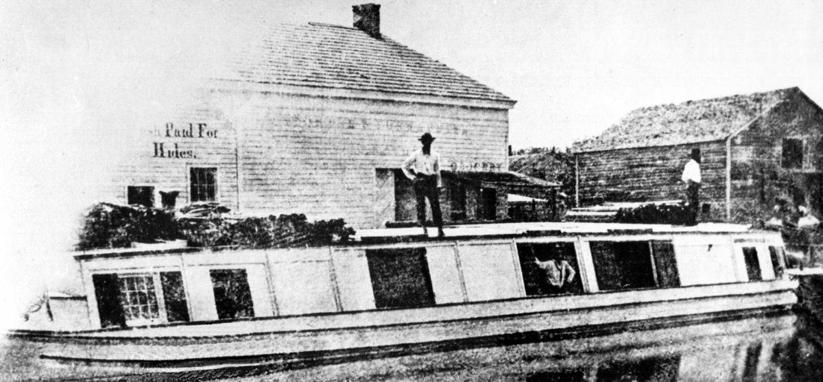 Historic black and white photo of a canal boat in Fort Wayne, Indiana