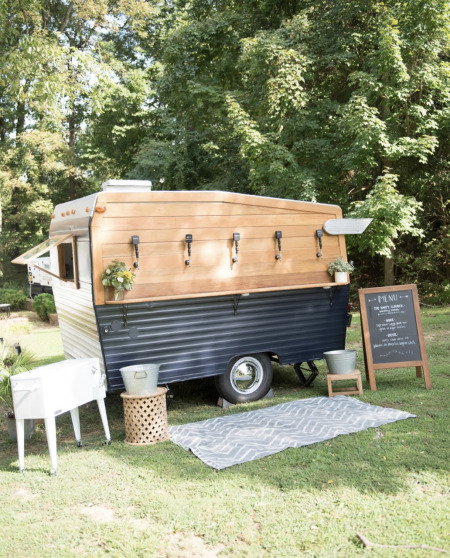 A camper tuned into a beer tap