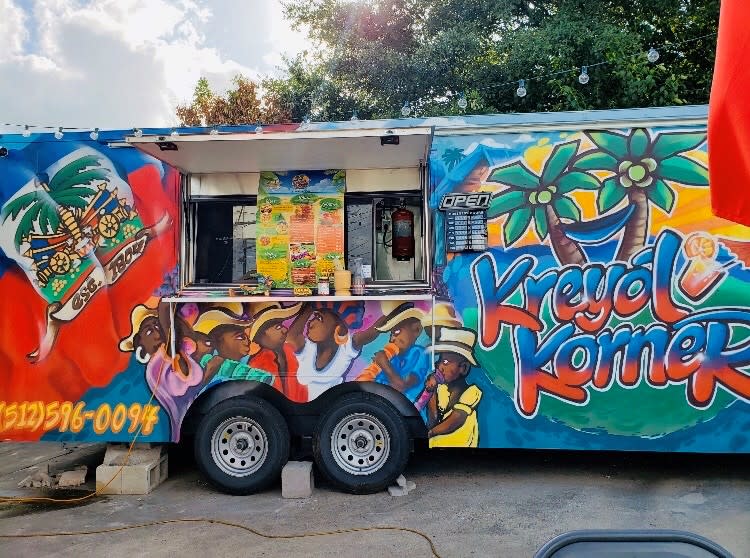 Photo of Kreyol Korner food truck with spray paint artwork in Austin Texas