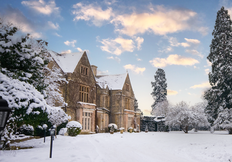 The Greenway Hotel surrounded by snow covered grounds and trees