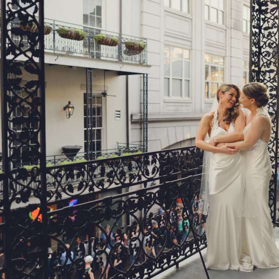 LGBT brides on balcony