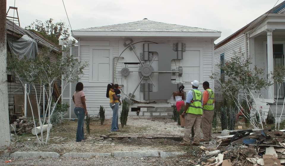 Prospect.6 - Mel Chin, Safehouse, 2008-2010. Existing house, stainless steel, steel, wood, plywood, Gatorboard ®, lead-encapsulation paint, automotive body and paint finishes, 12,000 brass thumbtacks, 6,000 unique hand-drawn Fundred Dollar Bills; overall: 18 x 22 x 40 ft, interior: 10 1/2 ft high. Image courtesy of the artist.