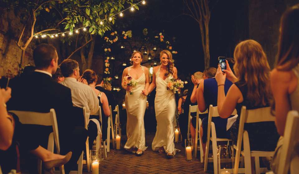 LGBT Brides at altar