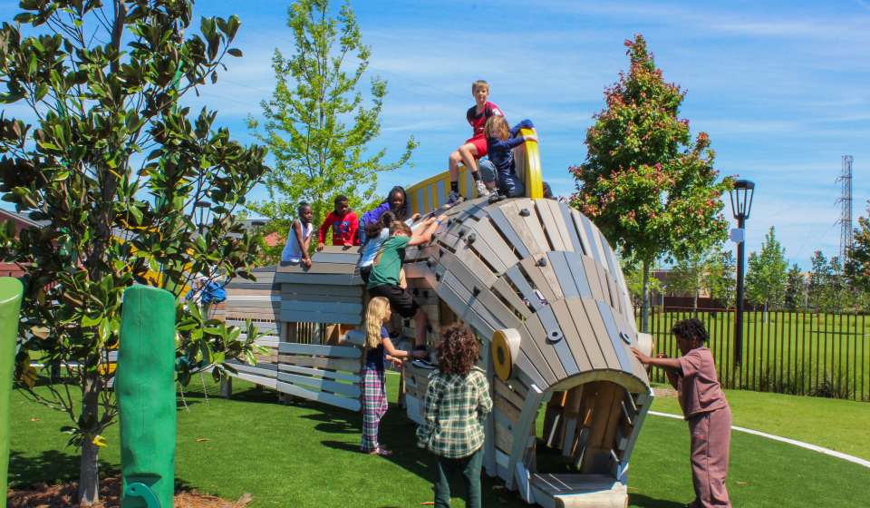 A group of hildren Play on the coastal Louisiana-inspired play equipment at the Goldring Woldenberg Riverfront Park in New Orleans, adjacent to the French Quarter.