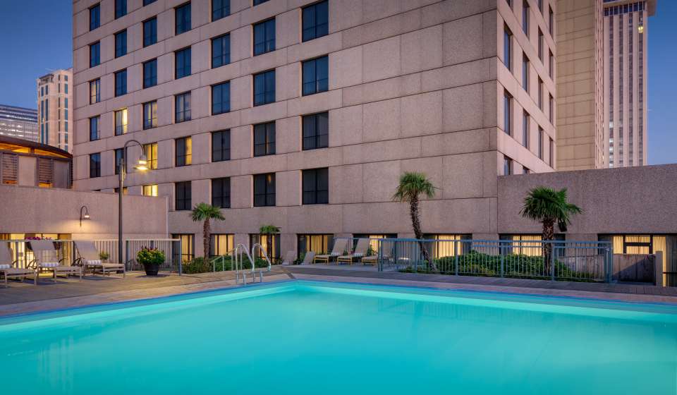 One of two heated outdoor pools at the Hilton Riverside Hotel in New Orleans. This picture shows an empty pool in the evening.