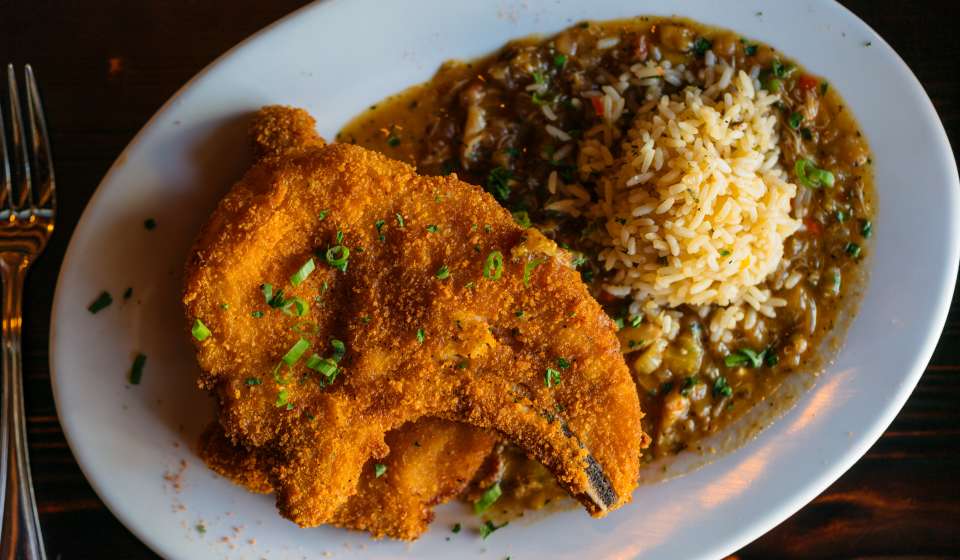 Fried Pork Chops with Crab Étouffée - Galliano Restaurant - Warehouse District