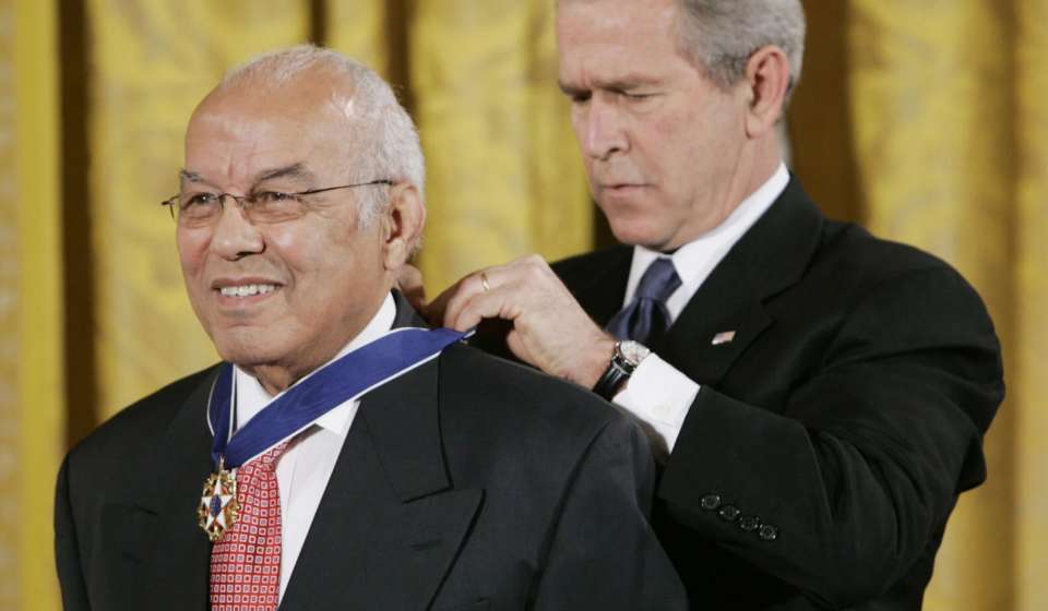 President Bush, right, bestows the Presidential Medal of Freedom to Xavier University of Louisiana President Norman C. Francis during a ceremony in the East Room of the White House in Washington, Friday, Dec. 15, 2006. Francis announced his retirement today.