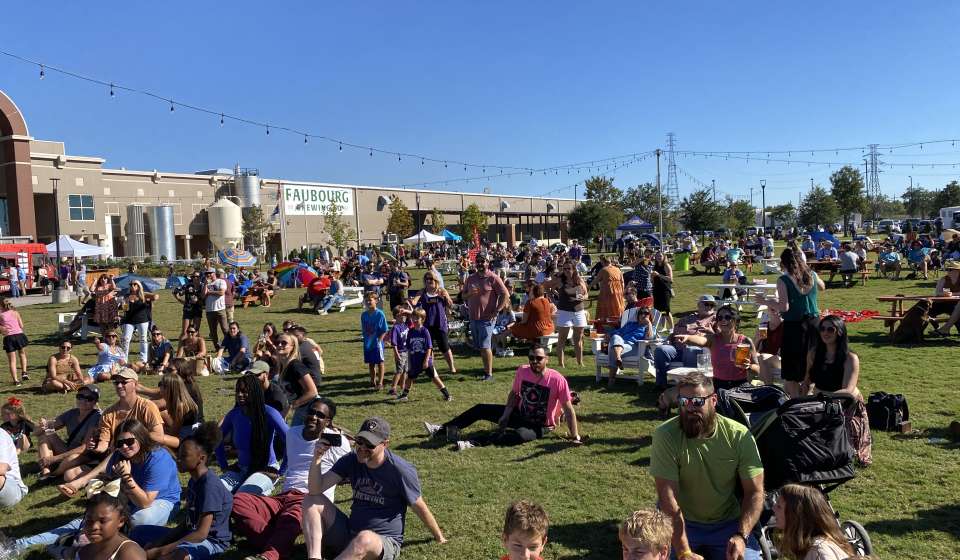 People gather on the lawn of Faubourg Brewery in New Orleans to celebrate Oktoberfest
