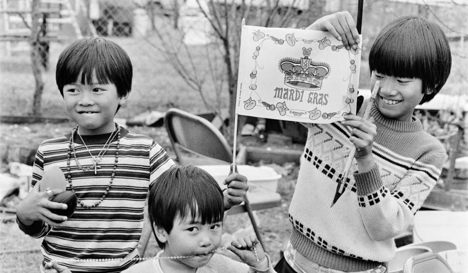 Children with Mardi Gras souvenirs, New Orleans East; 1985; photograph; by Mark J. Sindler; HNOC, acquisition made possible by the Laussat Society, MSS 1074.1.517.1
