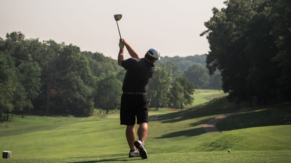 Man golfing in Santa Claus Indiana