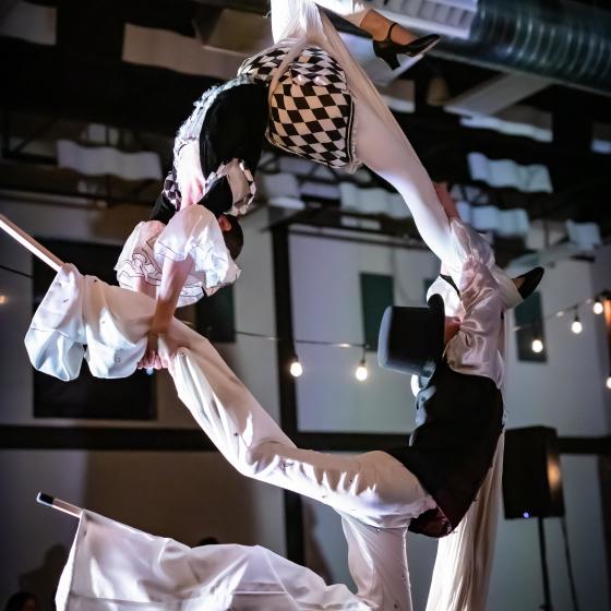 Partner aerial silks on stilts