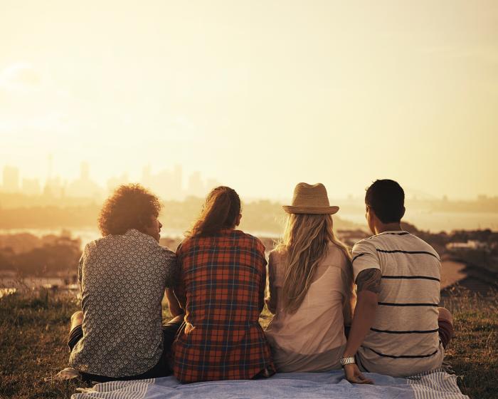 Group-of-friends-hanging-out-admiring-a-sunset-in-Oakland
