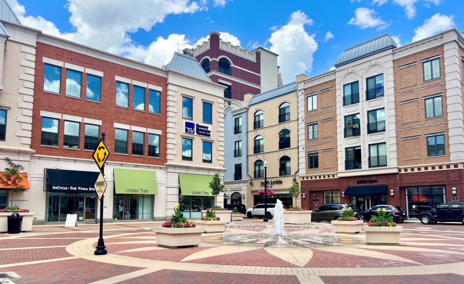 Buildings serve as the backdrop for a fountain in Carmel City Center.