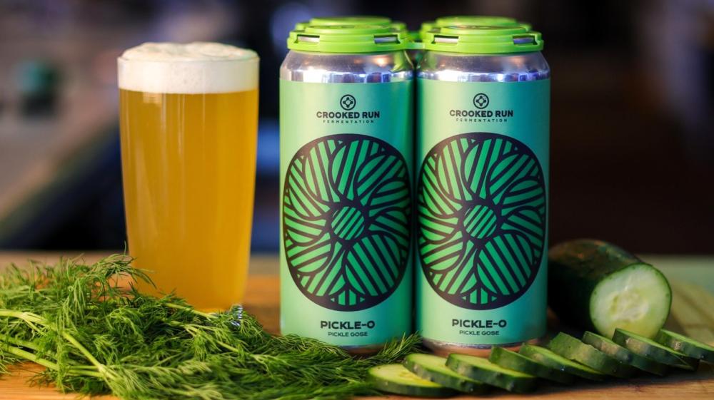 Crooked Run Fermentation's Pickle-O pickle gose cans with fresh dill and sliced cucumbers at Crooked Run in Loudoun County