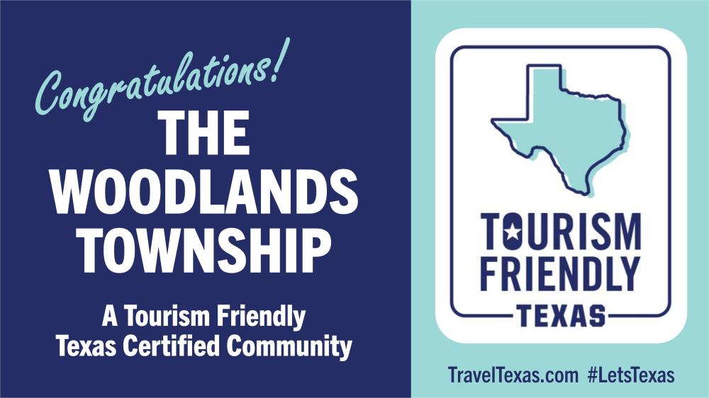 A banner that's split by two colors (dark blue and light teal). The dark side features bold white text reading, "Congratulations! THE WOODLANDS TOWNSHIP | A Tourism Friendly Texas Certified Community." The light side features a "Texas" logo and reads "TOURISM FRIENDLY | TEXAS" and "TravelTexas.com #LetsTexas" in bold blue letters.
