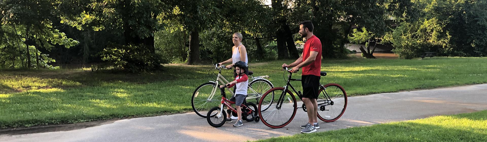 Family riding on the Mountains to the Sea trail in Smithfield, NC.