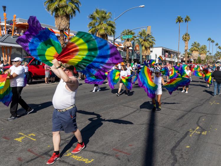 Group of men waiting for rainbow flags at the Palm Springs Pride Parade