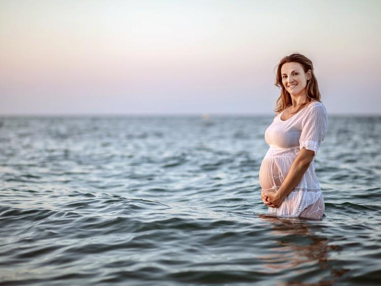 Pregnant Women Standing in Ocean - Beach Babymoon