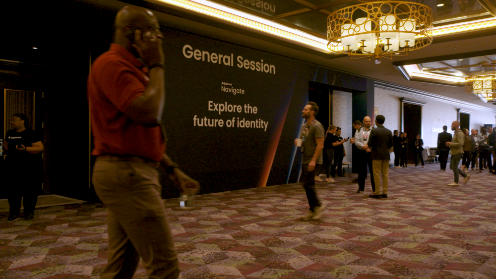 Meeting attendees walking through hotel meeting space to their next session.