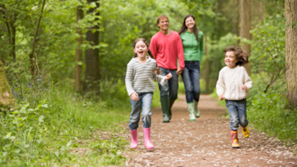 Family Enjoying A State Park Hike In Bastrop, TX