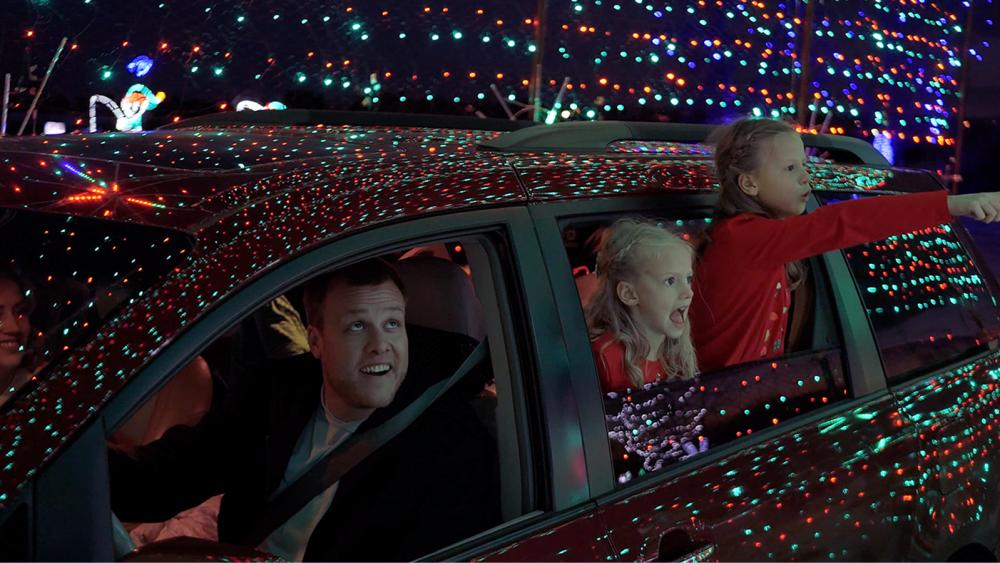 A family enjoys the holiday lights at NoCo Winter Wonderland
