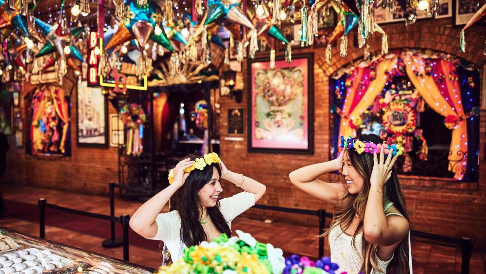 Two girls wearing flower crowns