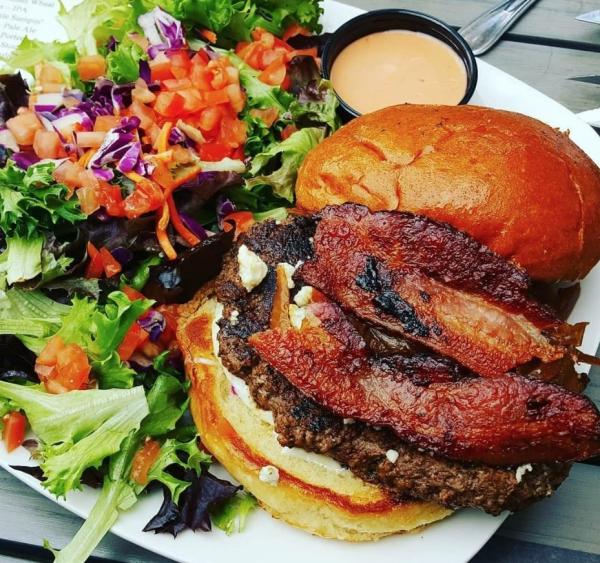 Plate with burger and salad