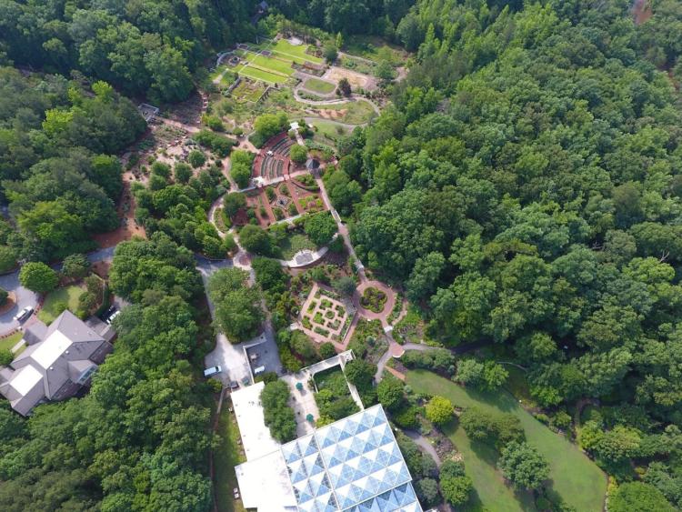 An overhead view of the State Botanical Garden of Georgia, populated with trees and walking paths.