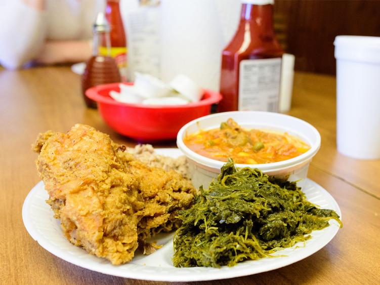 Plate of fried chicken and collards from White Swan BBQ in Smithfield, NC.