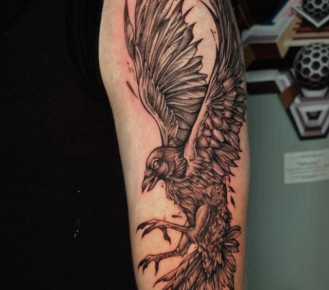 Intricate and detailed raven tattoo