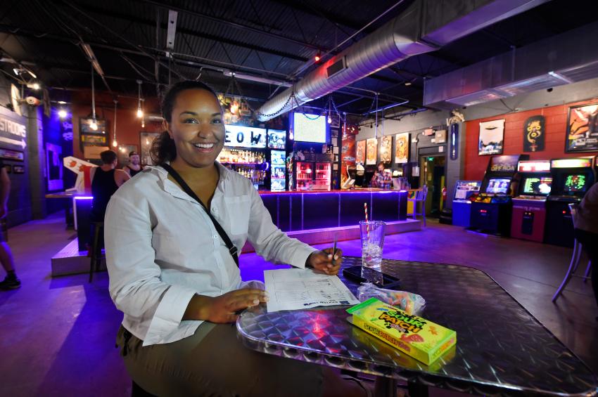Person Playing Trivia at Baxter Bar & Arcade