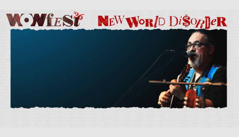 A person playing a guitar and talking into a microphone on a dark blue background. It says 'Wowfest26 New World Disorder'
